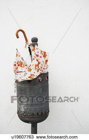 Umbrella in trash can View Large Photo Image Stock Image - Umbrella in trash can. Fotosearch