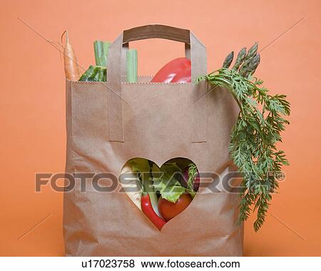 Vegetables in bag with heart symbol View Large Photo Image Stock Photo - Vegetables in bag with heart symbol. Fotosearch