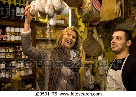 Vendor and customer in deli View Large Photo Image Stock Photography - Vendor and customer in deli. Fotosearch