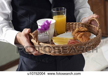 Waiter with breakfast tray View Large Photo Image Picture - Waiter with breakfast tray. Fotosearch