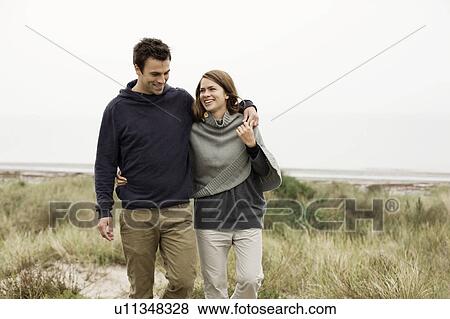 Stock Photo - Walking in the sand dunes. Fotosearch