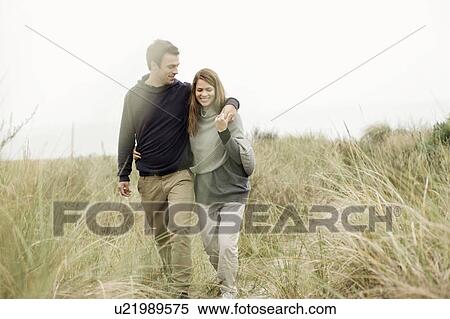 Stock Photography - Walking in the sand dunes. Fotosearch