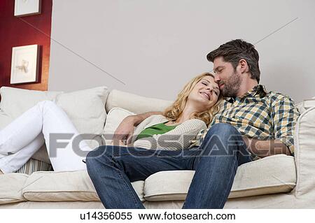 Wife and husband on couch View Large Photo Image Stock Photography - Wife and husband on couch. Fotosearch