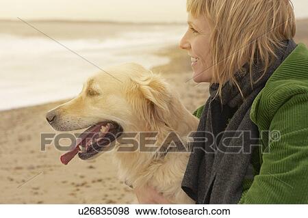 Woman and dog on beach View Large Photo Image Stock Photo - Woman and dog on beach. Fotosearch