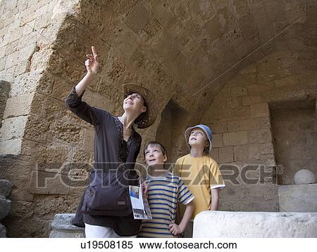 Woman and two boys at historical ruins View Large Photo Image Stock Photography - Woman and two boys at historical ruins. Fotosearch