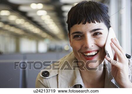 Woman at Airport phoning View Large Photo Image Stock Photo - Woman at Airport phoning. Fotosearch