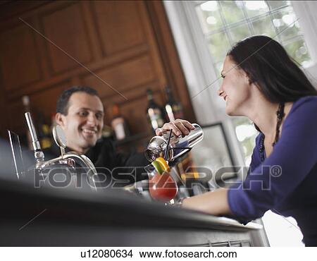 Woman at the bar View Large Photo Image Picture - Woman at the bar. Fotosearch