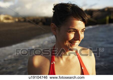 Woman by the sea at sunset View Large Photo Image Stock Photograph - Woman by the sea at sunset. Fotosearch