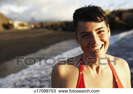 Stock Image - Woman by the sea portrait. Fotosearch
