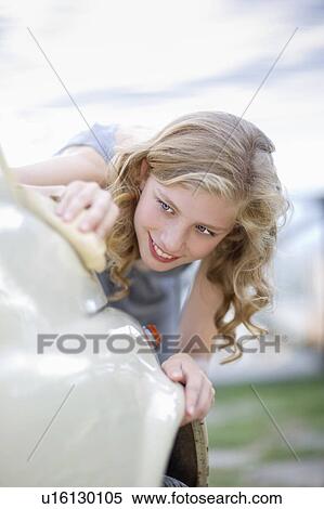 Woman cleaning a car View Large Photo Image Stock Photography - Woman cleaning a car. Fotosearch