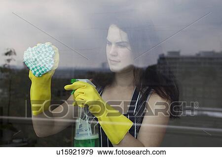 Stock Photo - Woman cleaning window. Fotosearch