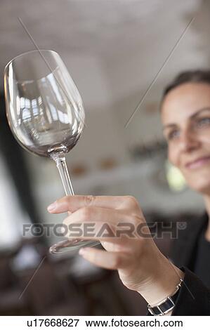Woman cleaning wine glass View Large Photo Image Stock Photo - Woman cleaning wine glass. Fotosearch
