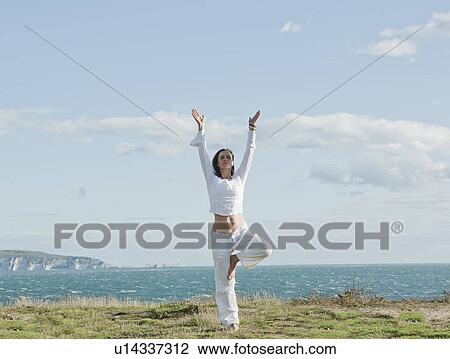Stock Image - Woman doing yoga. Fotosearch