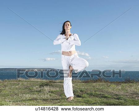 Woman doing yoga View Large Photo Image Stock Photo - Woman doing yoga. Fotosearch