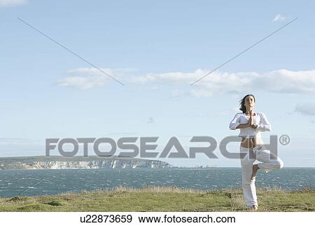 Woman doing yoga View Large Photo Image Stock Photo - Woman doing yoga. Fotosearch