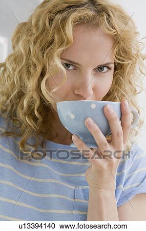 Stock Image - Woman drinking coffee. Fotosearch