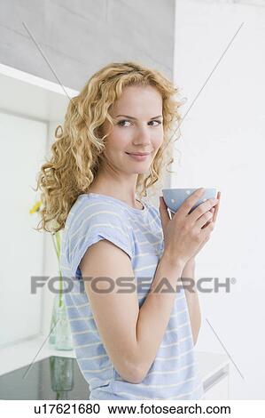 Woman drinking coffee View Large Photo Image Stock Image - Woman drinking coffee. Fotosearch