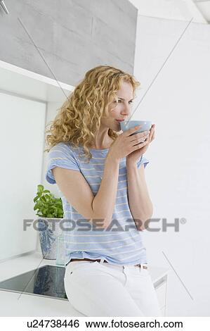 Woman drinking coffee View Large Photo Image Stock Photograph - Woman drinking coffee. Fotosearch