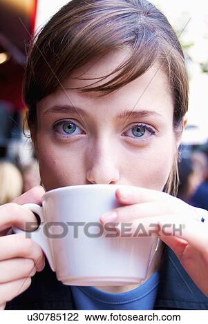 Woman drinks coffee in paris View Large Photo Image Stock Image - Woman drinks coffee in paris. Fotosearch