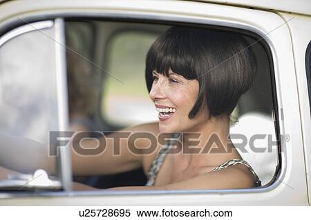 Woman driving a car View Large Photo Image Stock Photography - Woman driving a car. Fotosearch