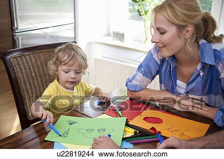 Picture - Woman handcrafting with son. Fotosearch