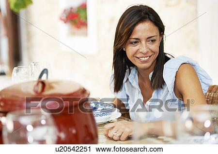 Woman having lunch View Large Photo Image Stock Image - Woman having lunch. Fotosearch