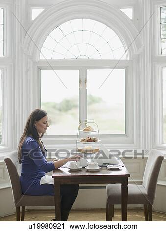 Woman having tea View Large Photo Image Stock Image - Woman having tea. Fotosearch