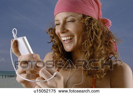 Stock Photography - Woman hearing music. Fotosearch
