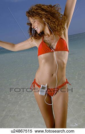 Woman hearing music View Large Photo Image Stock Photography - Woman hearing music. Fotosearch
