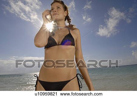 Woman hearing on a clam View Large Photo Image Stock Image - Woman hearing on a clam. Fotosearch