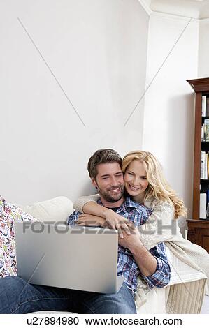 Woman hugging her man View Large Photo Image Stock Image - Woman hugging her man. Fotosearch