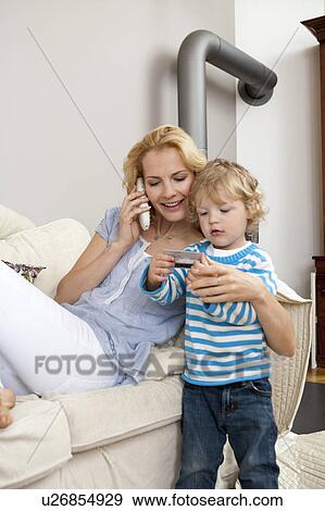 Woman hugging son View Large Photo Image Stock Photo - Woman hugging son. Fotosearch