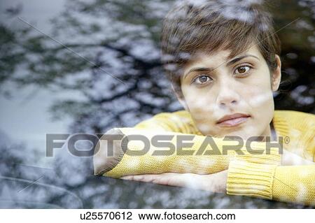 Woman in a car in the park View Large Photo Image Stock Image - Woman in a car in the park. Fotosearch