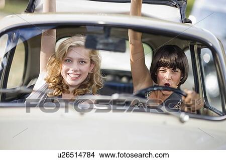 Woman in a car View Large Photo Image Picture - Woman in a car. Fotosearch
