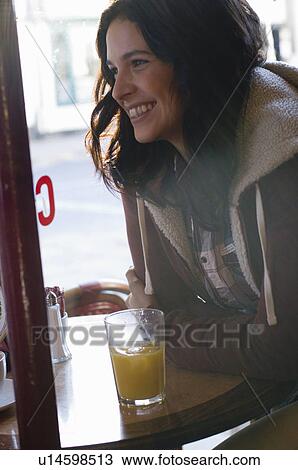 Stock Image - Woman in cafe. Fotosearch