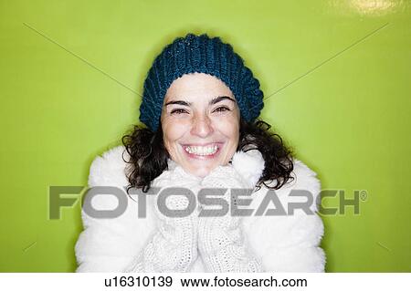 Woman in front of green wall View Large Photo Image Stock Photo - Woman in front of green wall. Fotosearch