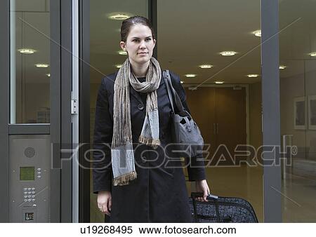 Woman leaving apartment block View Large Photo Image Stock Photography - Woman leaving apartment block. Fotosearch