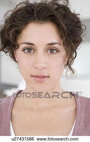 Stock Photo - Woman looking into camera. Fotosearch