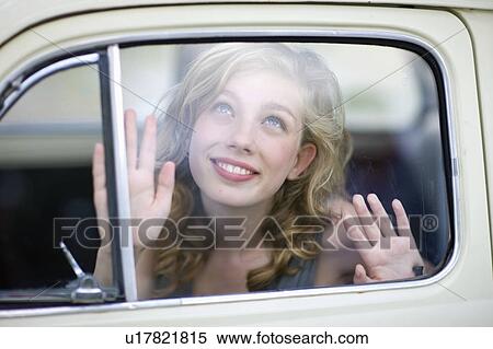 Woman looking out of a car View Large Photo Image Stock Photography - Woman looking out of a car. Fotosearch