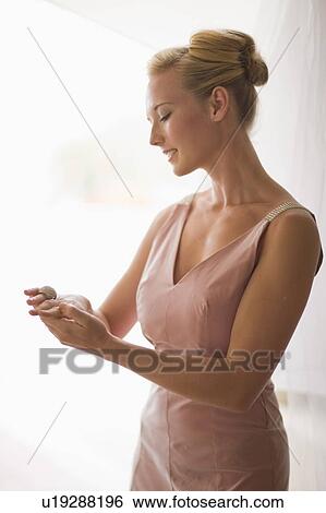 Woman marveling at ring View Large Photo Image Stock Photograph - Woman marveling at ring. Fotosearch