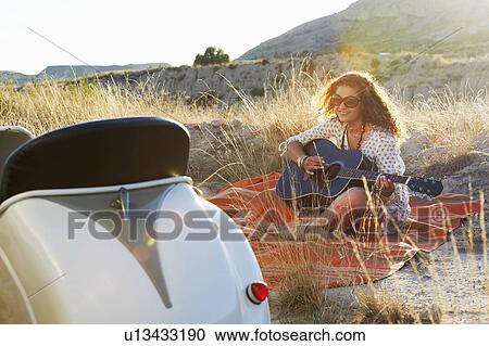 Woman playing the guitar View Large Photo Image Stock Image - Woman playing the guitar. Fotosearch