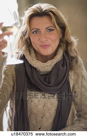 Stock Photography - Woman raising her glass. Fotosearch