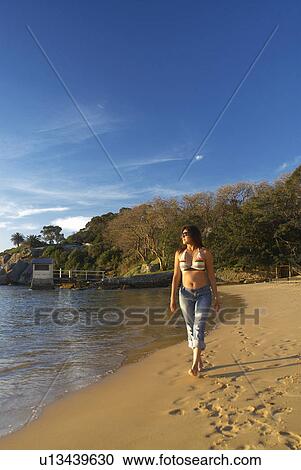 Woman relaxing by boat house View Large Photo Image Stock Image - Woman relaxing by boat house. Fotosearch