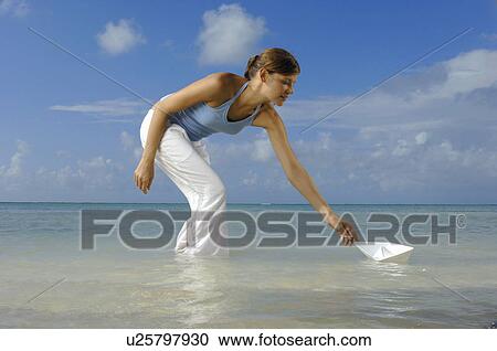 Woman relaxing on beach View Large Photo Image Stock Image - Woman relaxing on beach. Fotosearch