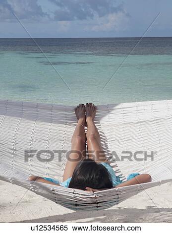 Stock Photography - Woman relaxing. Fotosearch