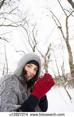 Picture - Woman rubbing hands. Fotosearch