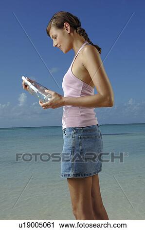 Woman sending postbottle View Large Photo Image Stock Image - Woman sending postbottle. Fotosearch