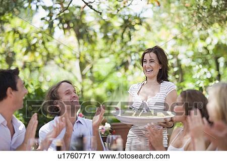 Woman serving pasta View Large Photo Image Stock Photo - Woman serving pasta. Fotosearch