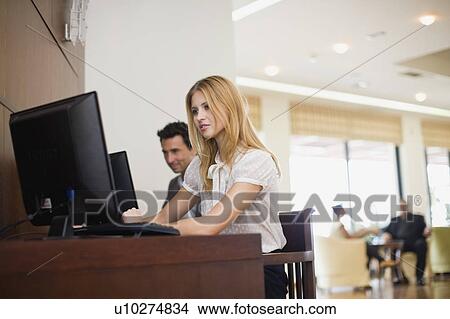 Woman sitting at computer View Large Photo Image Picture - Woman sitting at computer. Fotosearch