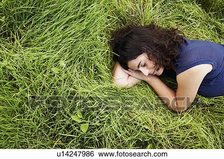 Woman sleeping in meadow View Large Photo Image Stock Photograph - Woman sleeping in meadow. Fotosearch
